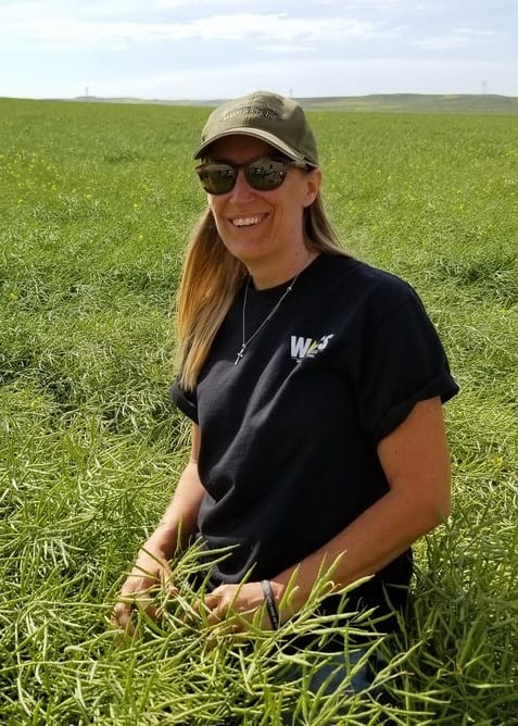 Karen Sowers PNWCA Executive Director, Karen Sowers in winter canola field in MT